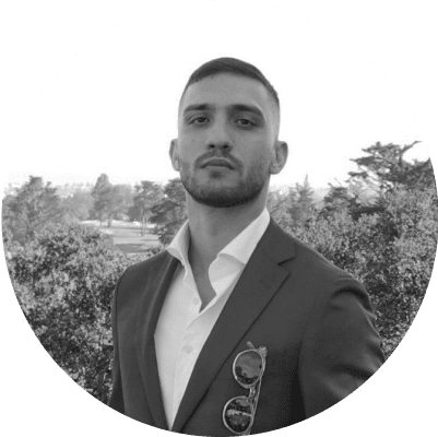 Headshot of Nima Hosseinzadeh, PhD, Founder, smiling and wearing professional attire.